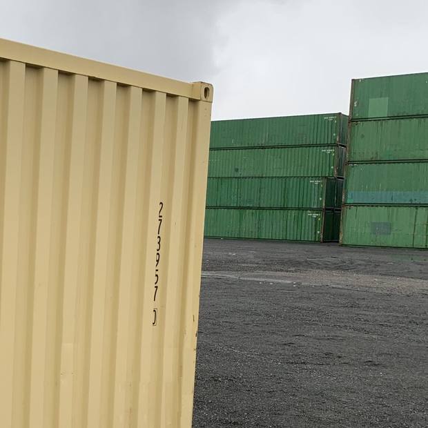 Container cargo doors open showing locking bars and lockbox